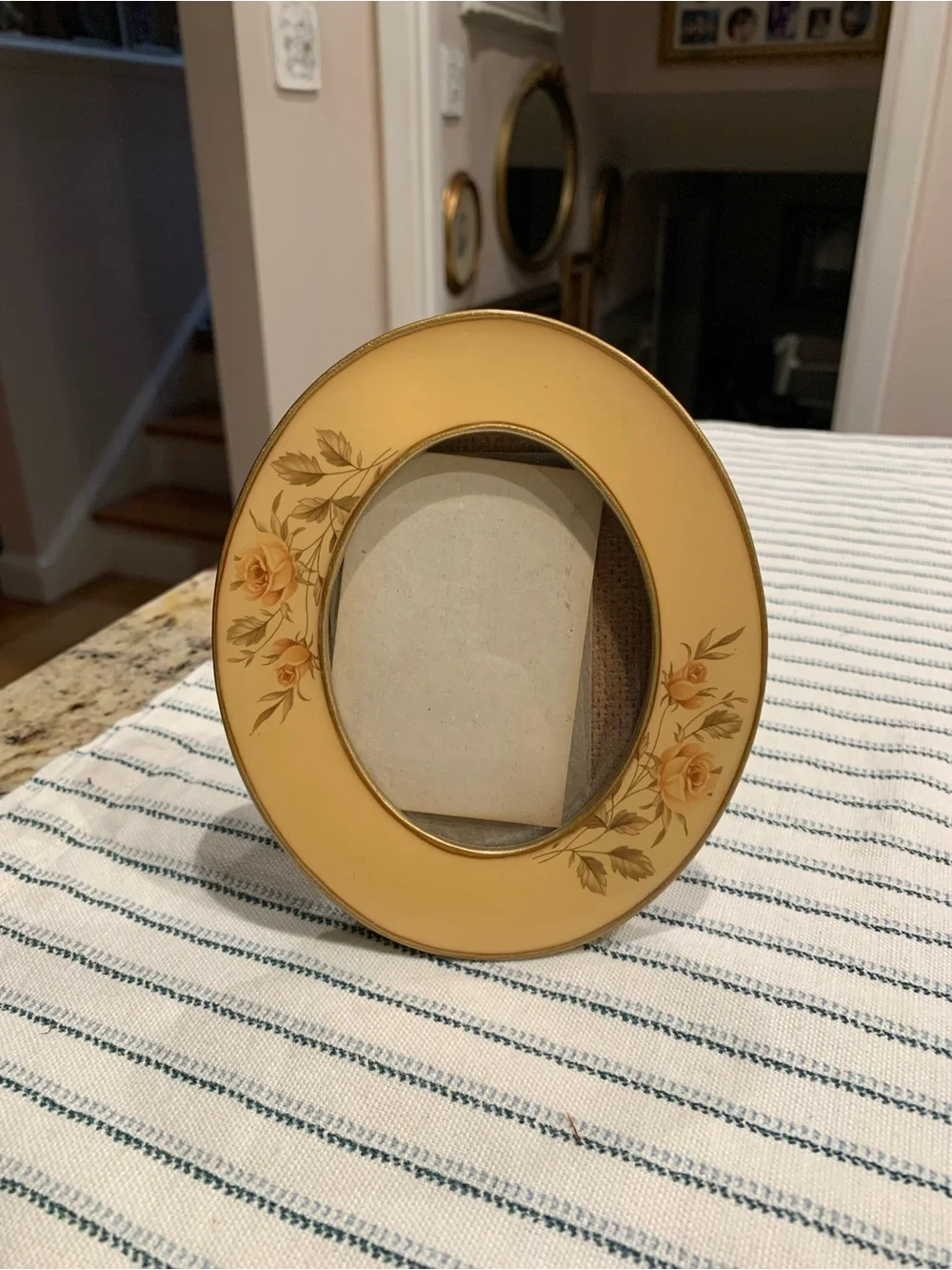 Vintage enamel oval photo frame featuring delicate yellow rose floral